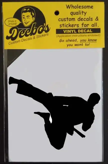 A silhouette figure doing a round house kick kung fu style decal