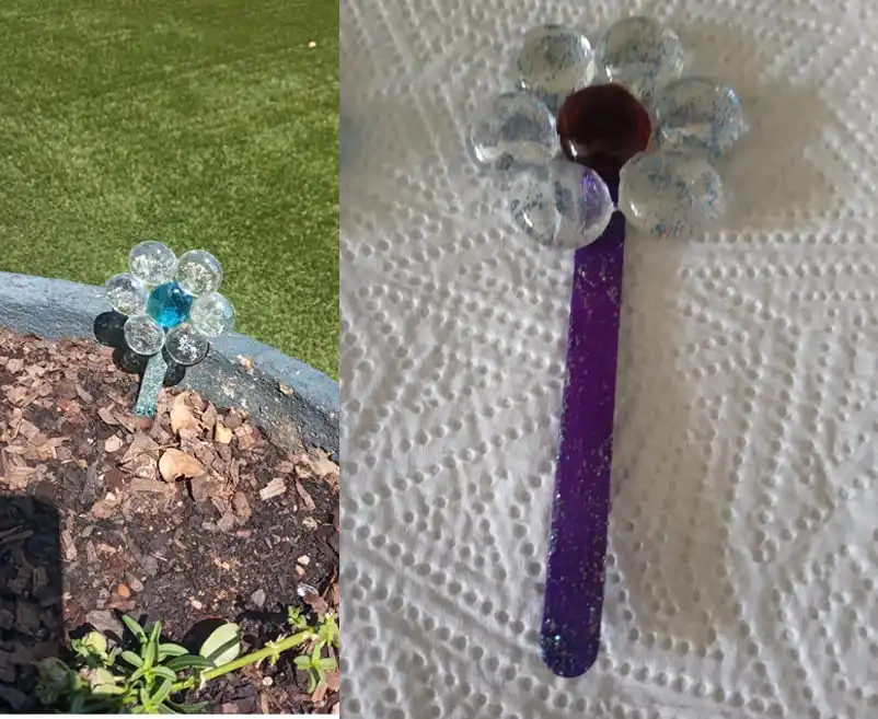 A handcrafted Quirky Craft Suncatcher in a pot plant