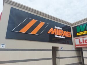 midas car part sign on the oustside of a builing