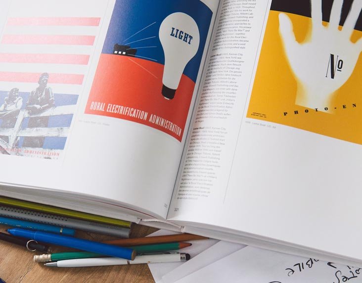 an open graphic design book on table